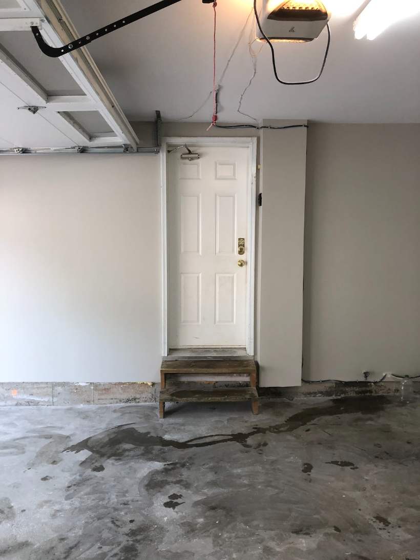 Finished basement with under-stair nook, smooth walls and pot lights